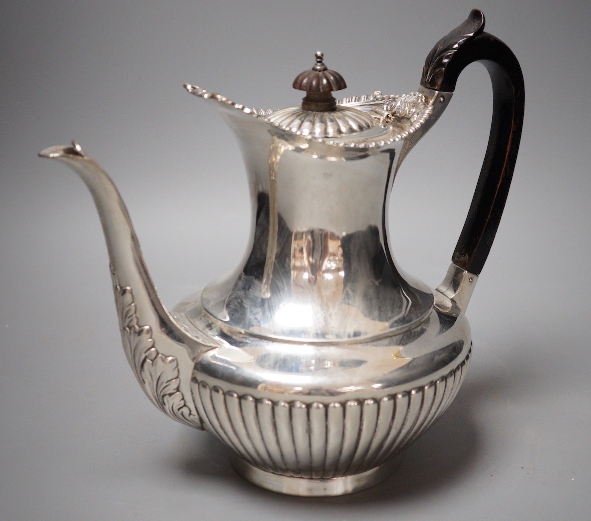 A late Victorian demi-fluted silver coffee pot, Gibson & Langman (Goldsmiths & Silversmiths Co Ltd), London, 1898, height 22.8cm